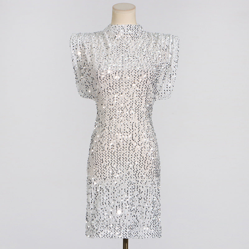 A white sequined dress with cap sleeves and a high neckline displayed on a mannequin.
