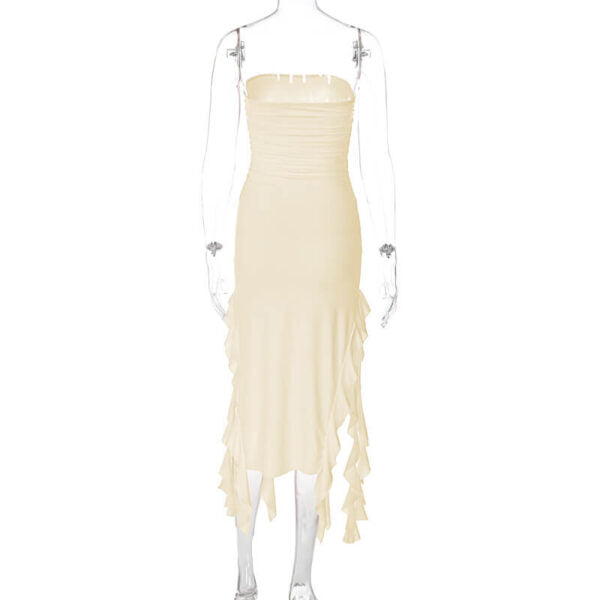Back view of a cream strapless ruched midi dress with ruffled asymmetrical hemline and high slit on a mannequin.