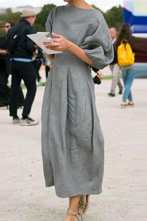 woman in gray midi dress with puff sleeves