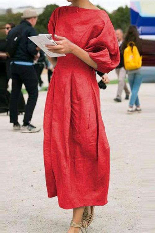 woman in red midi dress with puff sleeves