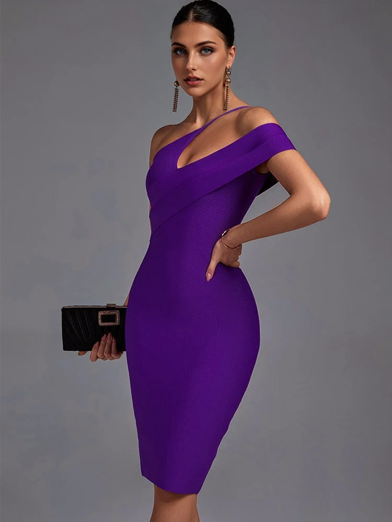 Woman in a purple one-shoulder dress with a black clutch