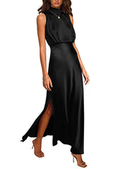 Woman wearing a black satin maxi dress with a high neckline, sleeveless design, and a high slit on the leg.