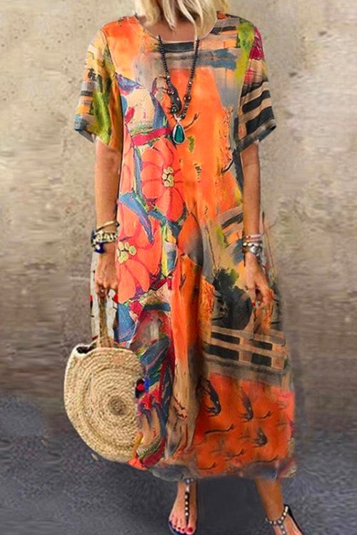 woman wearing an orange abstract print midi dress