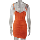 back view of an orange ruched mini dress with a corset bodice on a mannequin