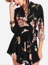 woman wearing a black floral wrap dress