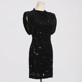 black sequined dress on a mannequin, side view