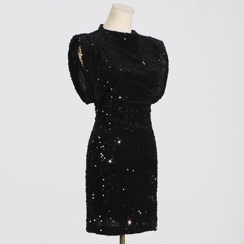 black sequined dress on a mannequin, side view