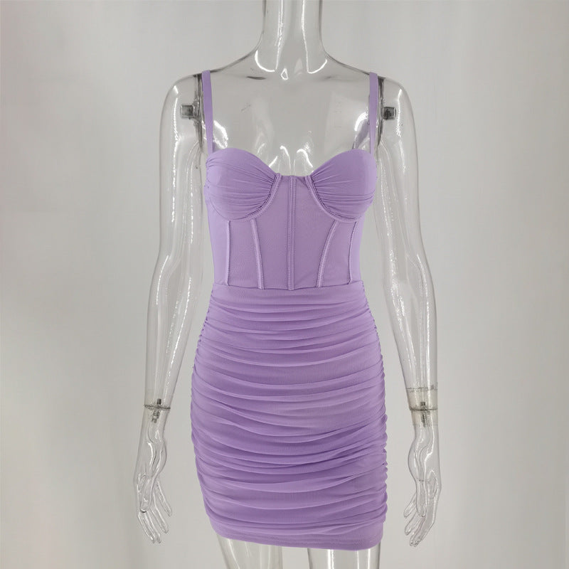 Front view of a lavender ruched mini dress with a corset bodice on a mannequin
