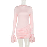 A light pink long-sleeved ruched mini dress with ruffled sleeves displayed on a mannequin.