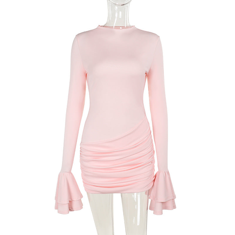 A light pink long-sleeved ruched mini dress with ruffled sleeves displayed on a mannequin.