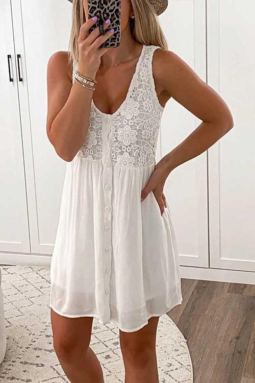 woman wearing a white sleeveless v-neck lace-trim button-down a-line dress