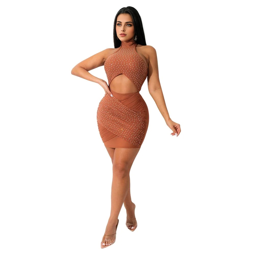Woman in a brown sleeveless halter dress with a cutout and rhinestone embellishments
