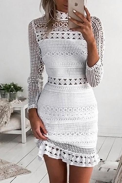 Woman taking a selfie in a white lace bodycon dress with long sleeves and a ruffle hem.