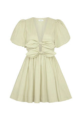 front view of a light green puff sleeve dress with a plunging V-neck and large bow detail at the waist