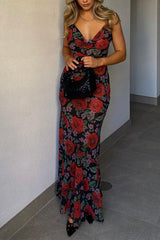 Side view of a woman in a sheer floral dress with red roses, showing the back and shoulder.