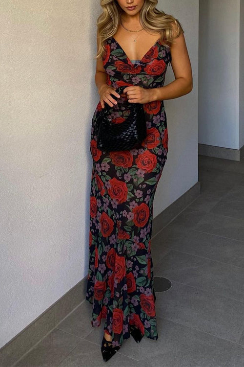 Side view of a woman in a sheer floral dress with red roses, showing the back and shoulder.