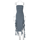 Mannequin displaying a slate gray strapless ruched dress with ruffled fringe detailing.
