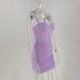 Side view of a lavender ruched mini dress with a corset bodice on a mannequin