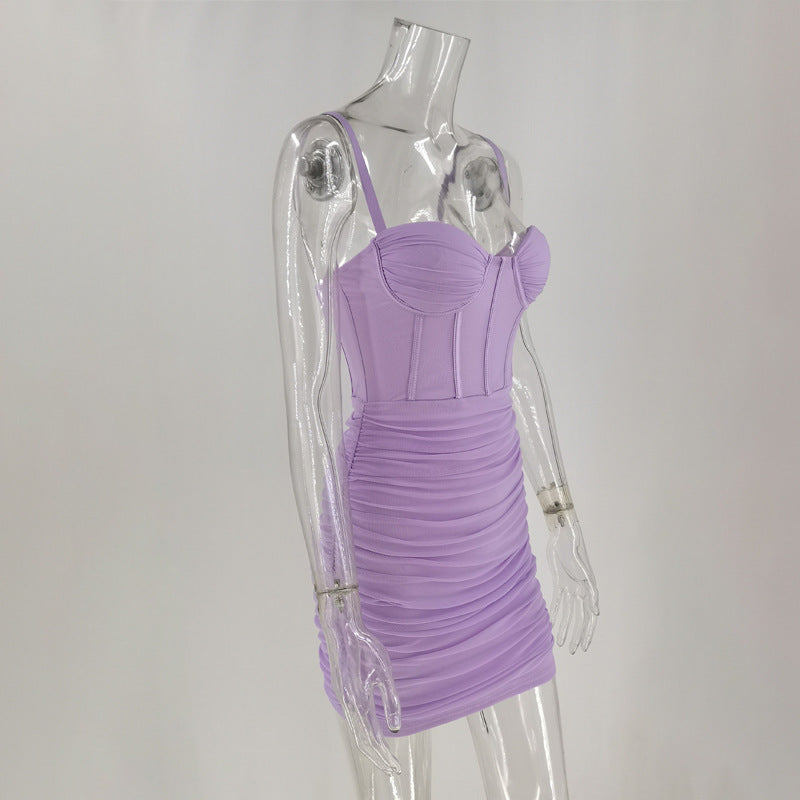 Side view of a lavender ruched mini dress with a corset bodice on a mannequin