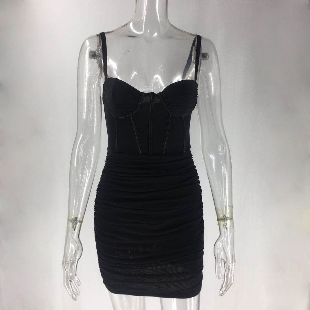 Black ruched mini dress with corset bodice on a mannequin