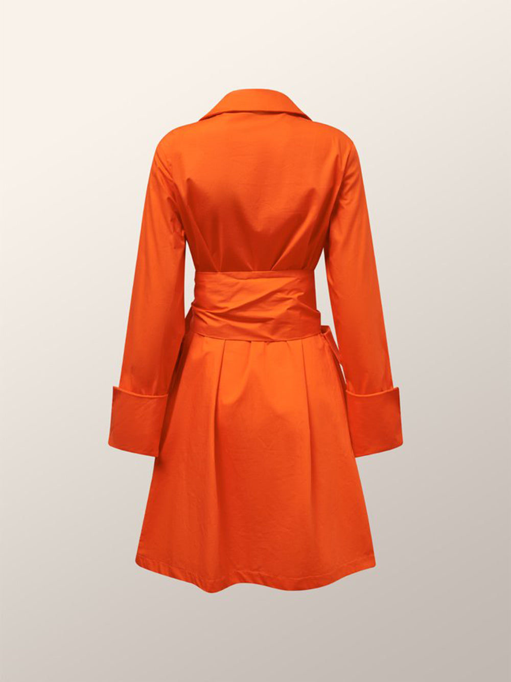 back view of an orange wrap dress with a tie waist and pleated skirt