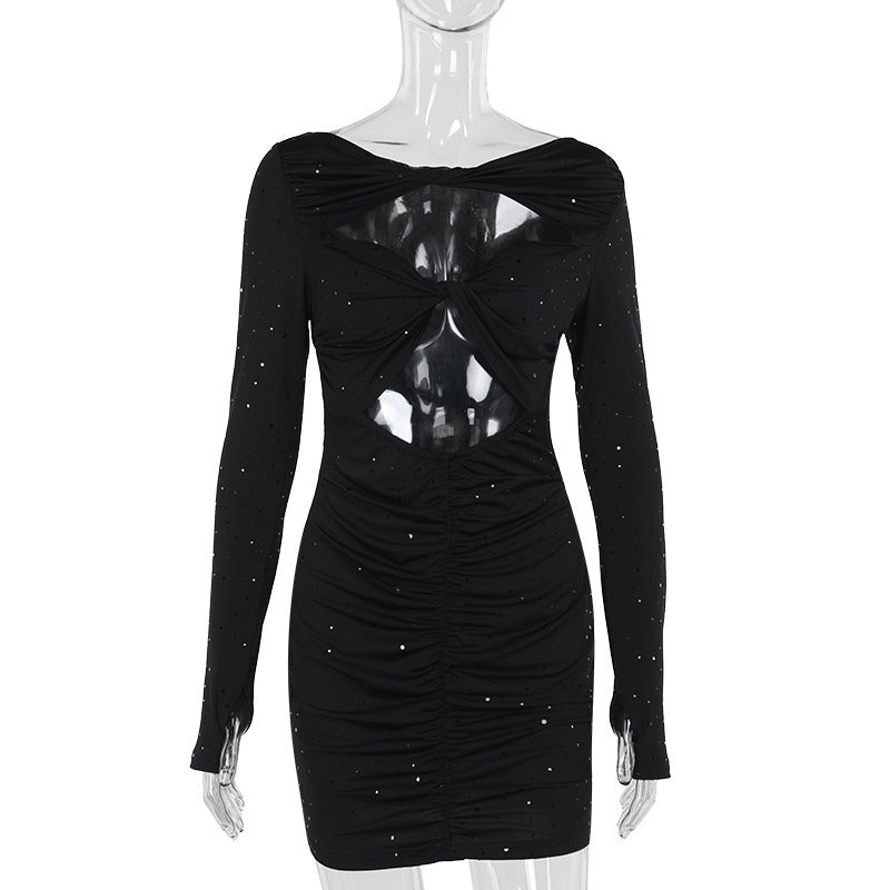 Black sparkling cut-out dress on a mannequin, front view
