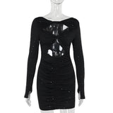 Black sparkling cut-out dress on a mannequin, front view