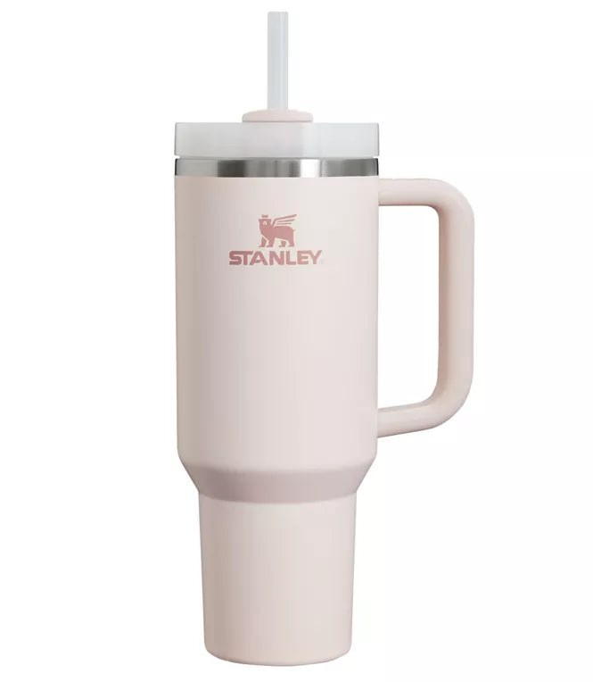 Stanley Quencher H2.0 FlowState Tumbler in pink with a handle and straw