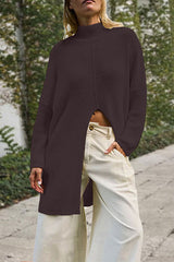 woman wearing a dark brown long knit sweater with a high slit