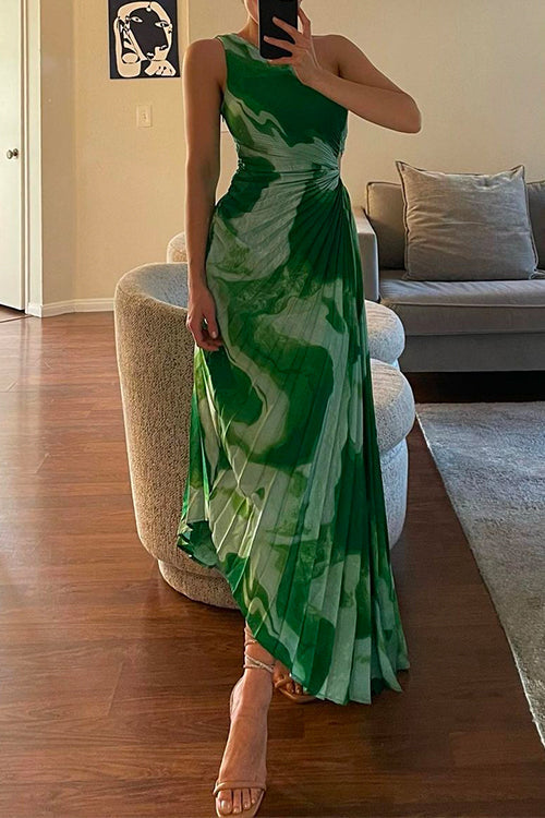 woman in a green and white tie-dye pleated one-shoulder maxi dress