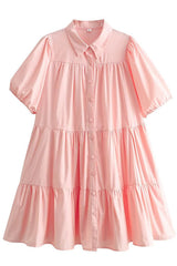 A pink tiered babydoll dress with puff sleeves and a collared neckline.