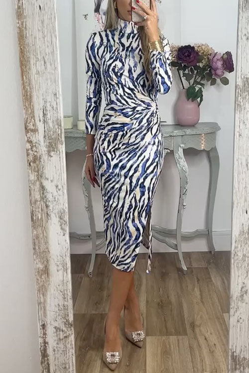 woman in blue and white zebra print dress
