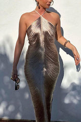 Woman wearing a champagne ruched halter neck maxi dress