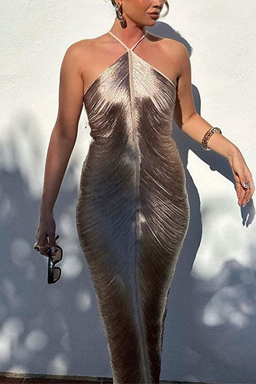 Woman wearing a champagne ruched halter neck maxi dress