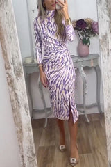 woman in purple and white zebra print dress