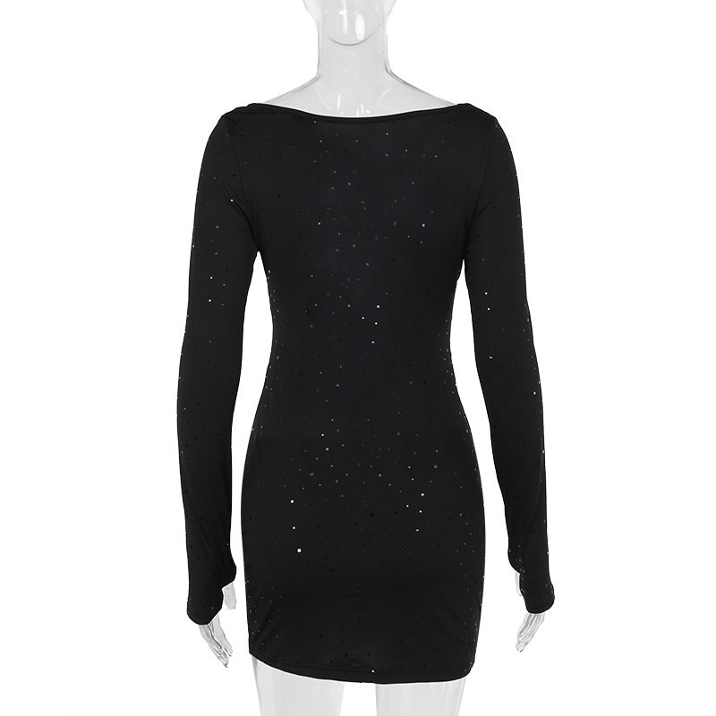 Black sparkling cut-out dress on a mannequin, back view
