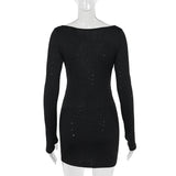 Black sparkling cut-out dress on a mannequin, back view