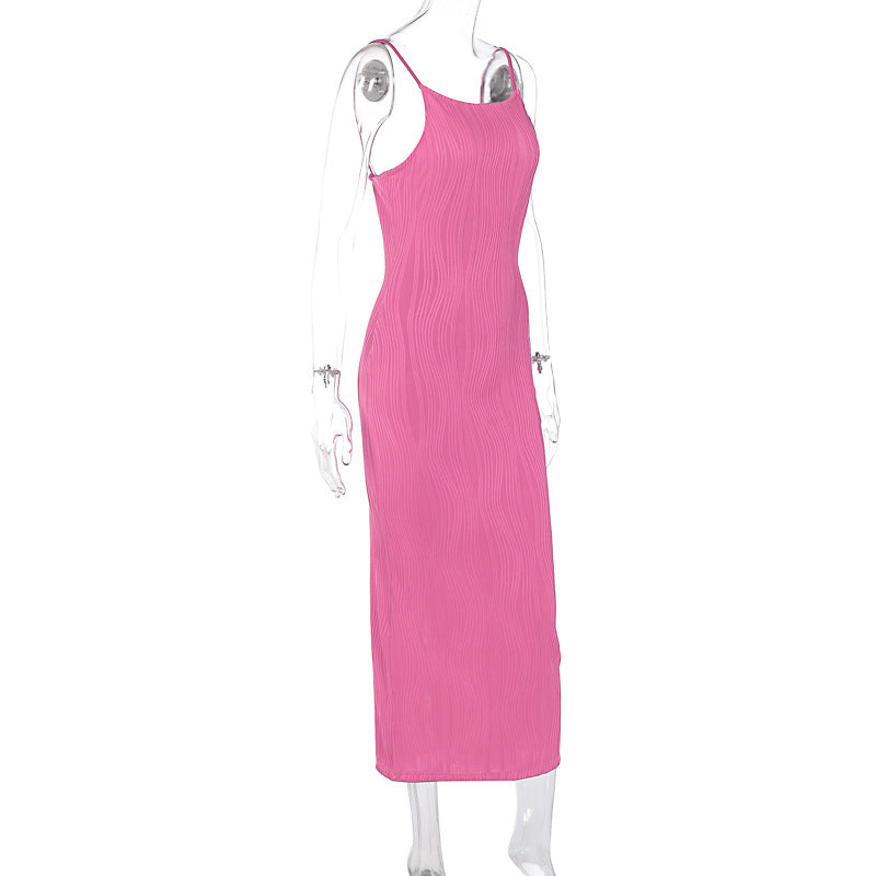 Side view of a pink ribbed midi dress on a mannequin