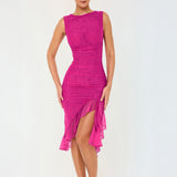 A woman in a hot pink ruched mesh dress with a high slit and ruffle trim poses against a white background, showing the full length of the dress.
