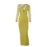 A lime green maxi dress with an asymmetrical neckline, cut-outs, and long sleeves, displayed flat.