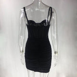 Back view of a black ruched mini dress with corset bodice on a mannequin