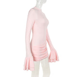 A side view of a light pink long-sleeved ruched mini dress with ruffled sleeves on a mannequin.