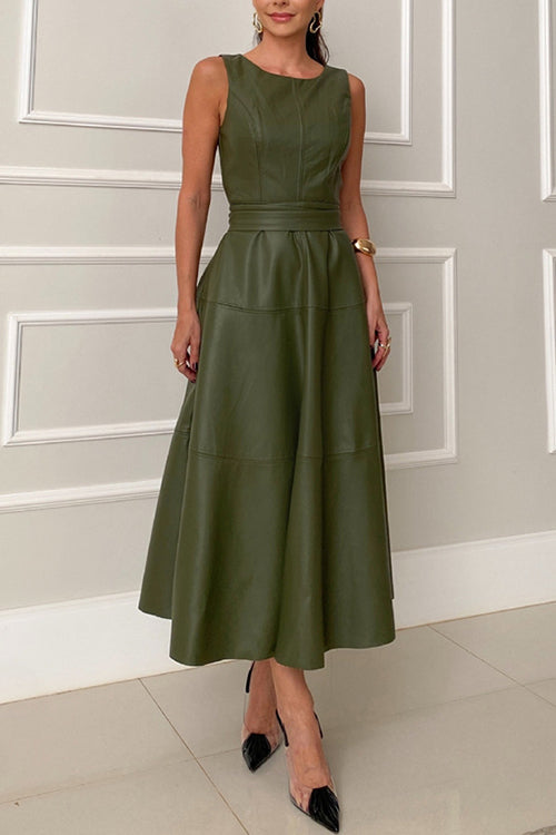 Woman wearing a sleeveless olive green faux leather midi dress with a belted waist and a flared skirt, front view