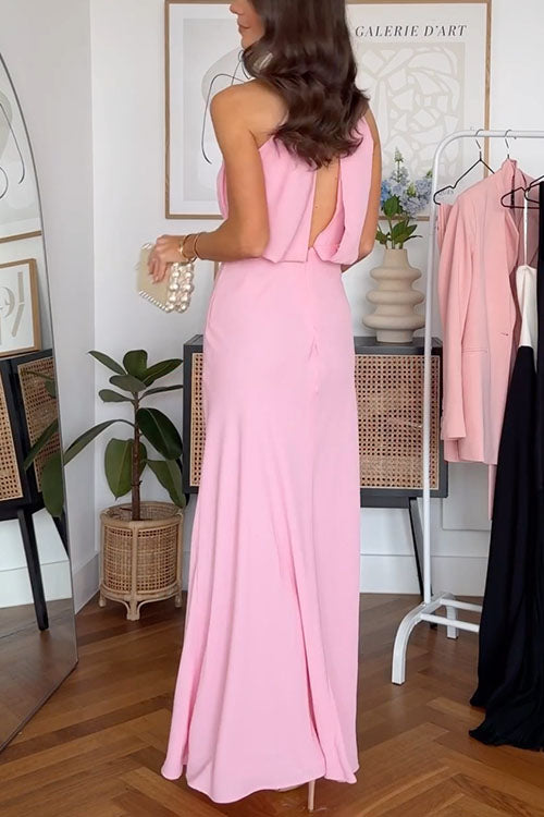 The back of a pink maxi dress with an open back detail.