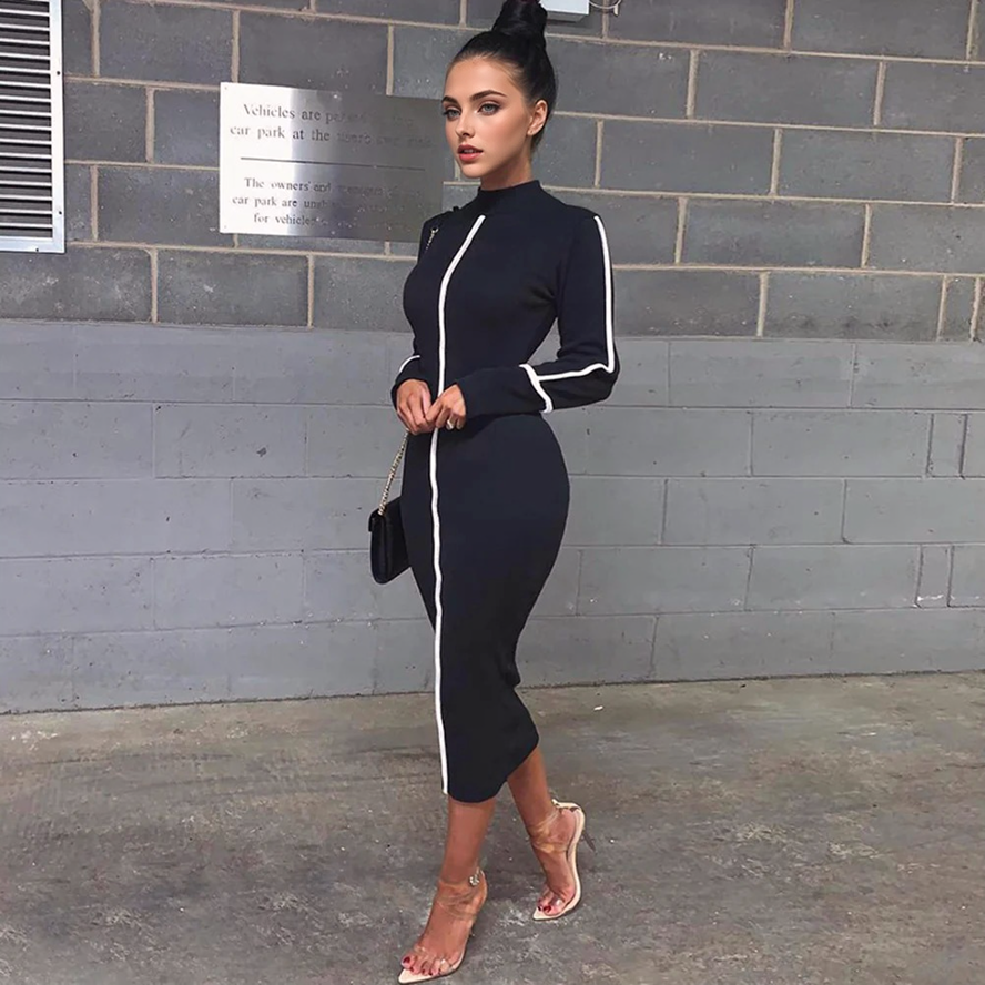 woman wearing a black midi dress with white stripes
