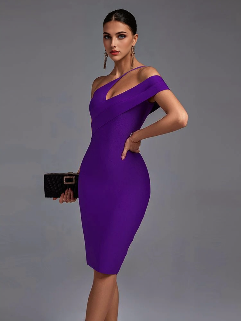 Woman in a purple one-shoulder dress holding a black clutch