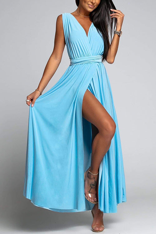 woman in a blue maxi dress with a high slit and deep v-neck