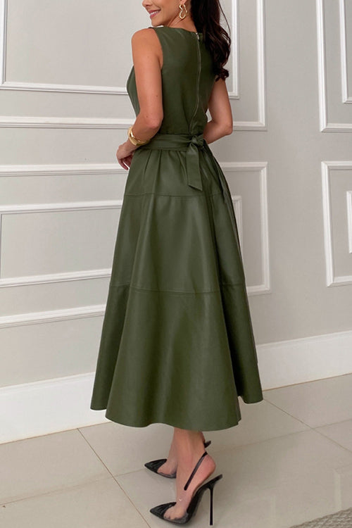 Woman wearing a sleeveless olive green faux leather midi dress with a belted waist and a flared skirt, back view