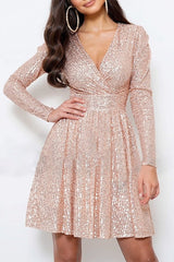 Close-up of a woman in a rose gold sequin dress