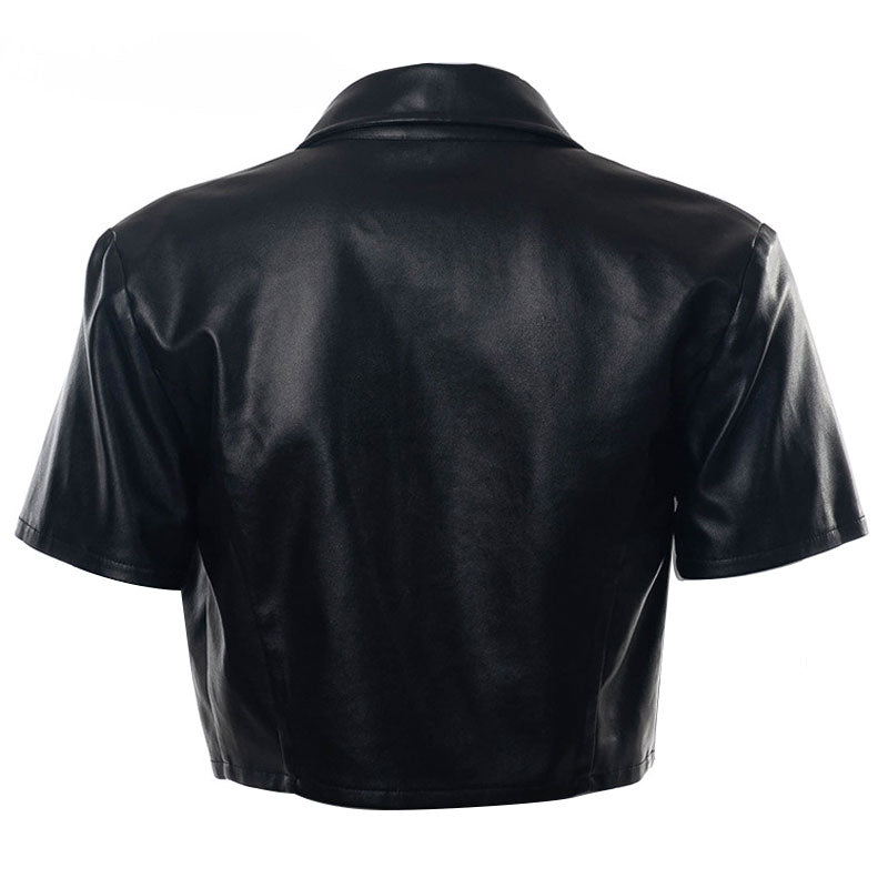 The back of a black faux leather cropped shirt with short sleeves and a collar.
